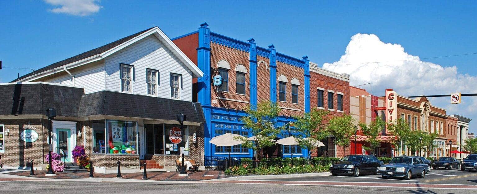 a close up of a street in front of a brick building
